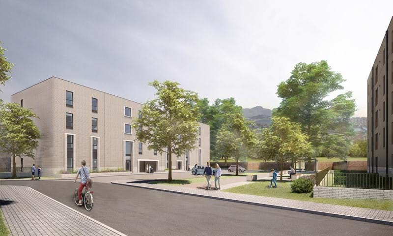 new building with cyclist and trees