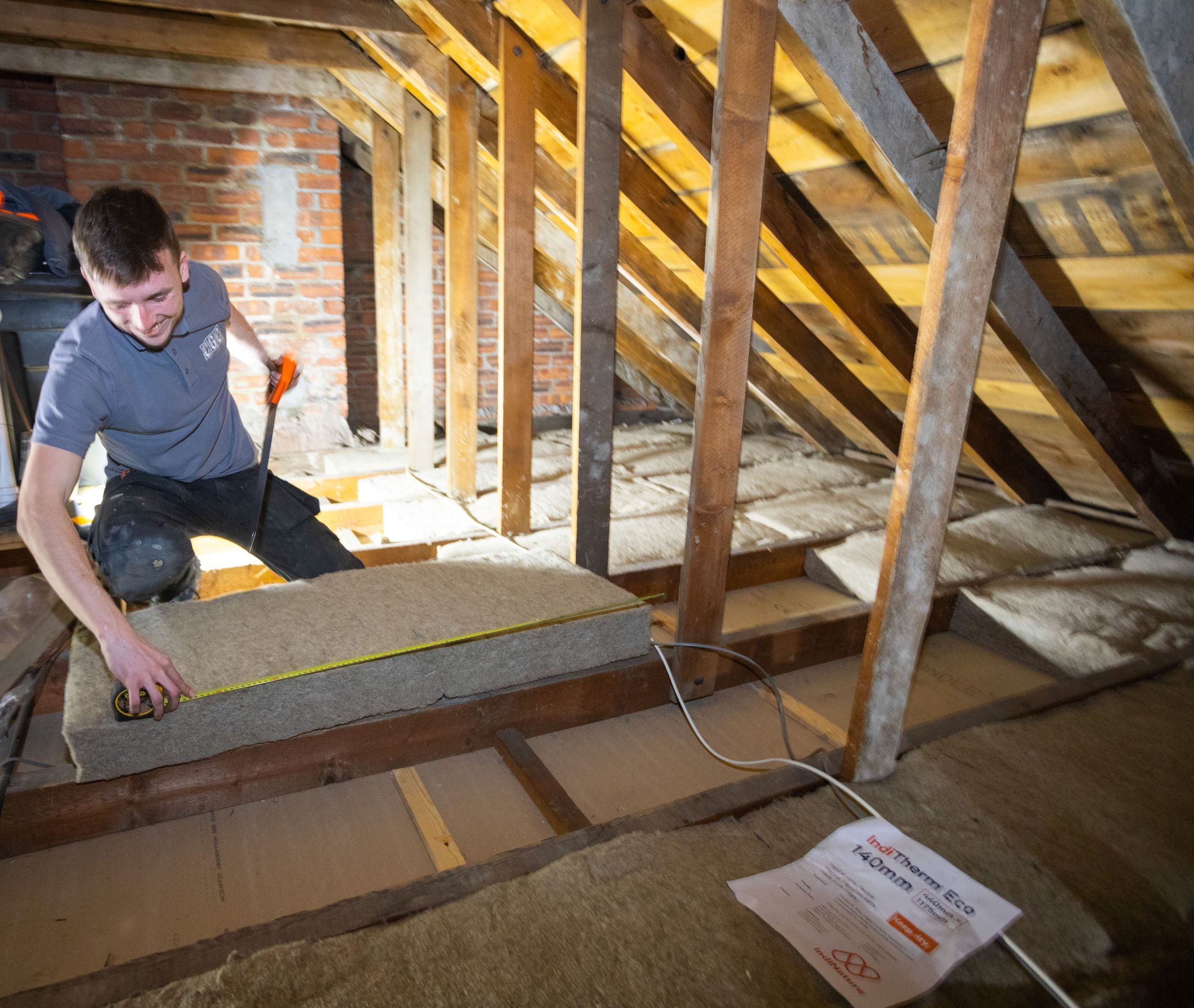 man doing work in attic