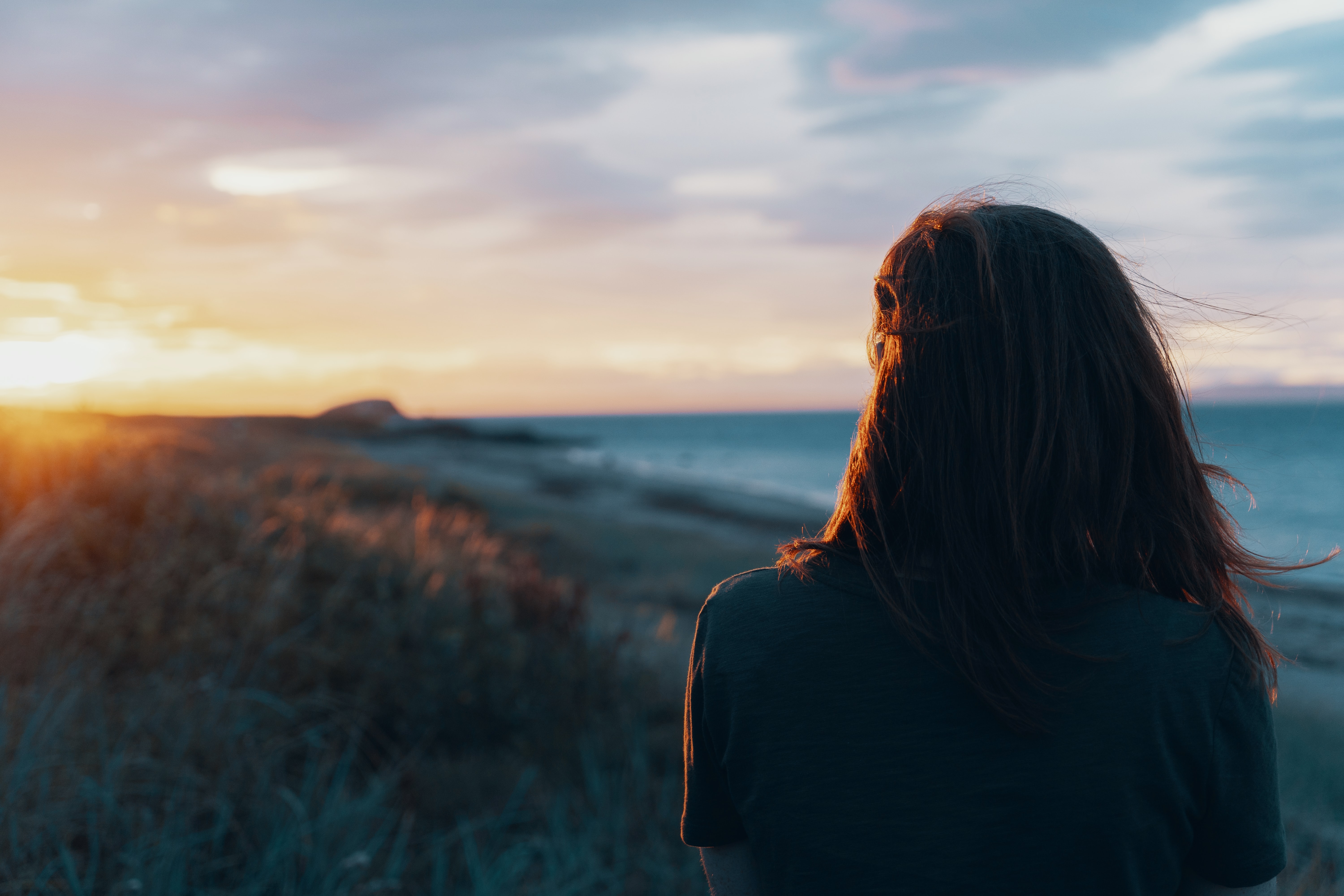 Girl looking over at sunrise