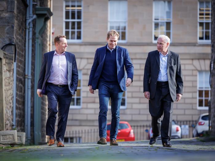 Jimmy Williamson walks along with Andrew Noble and Paul Munn.