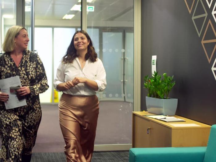 Business professionals walking through a hall